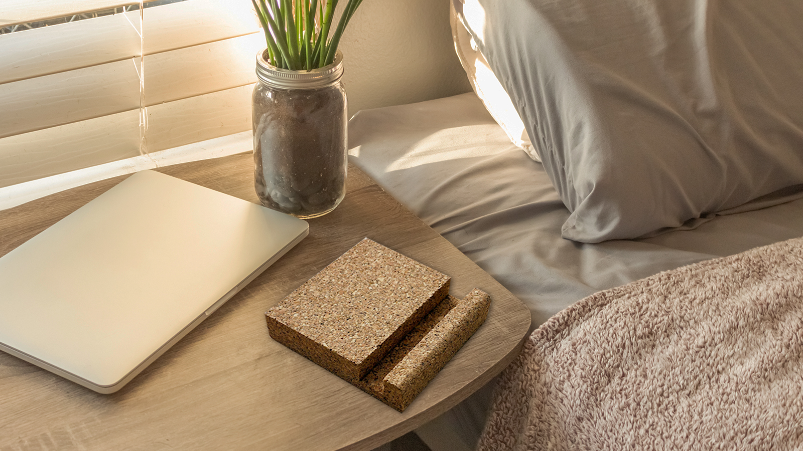 Bed Side Table Top with Laptop and Plant Work from Home Backgrou